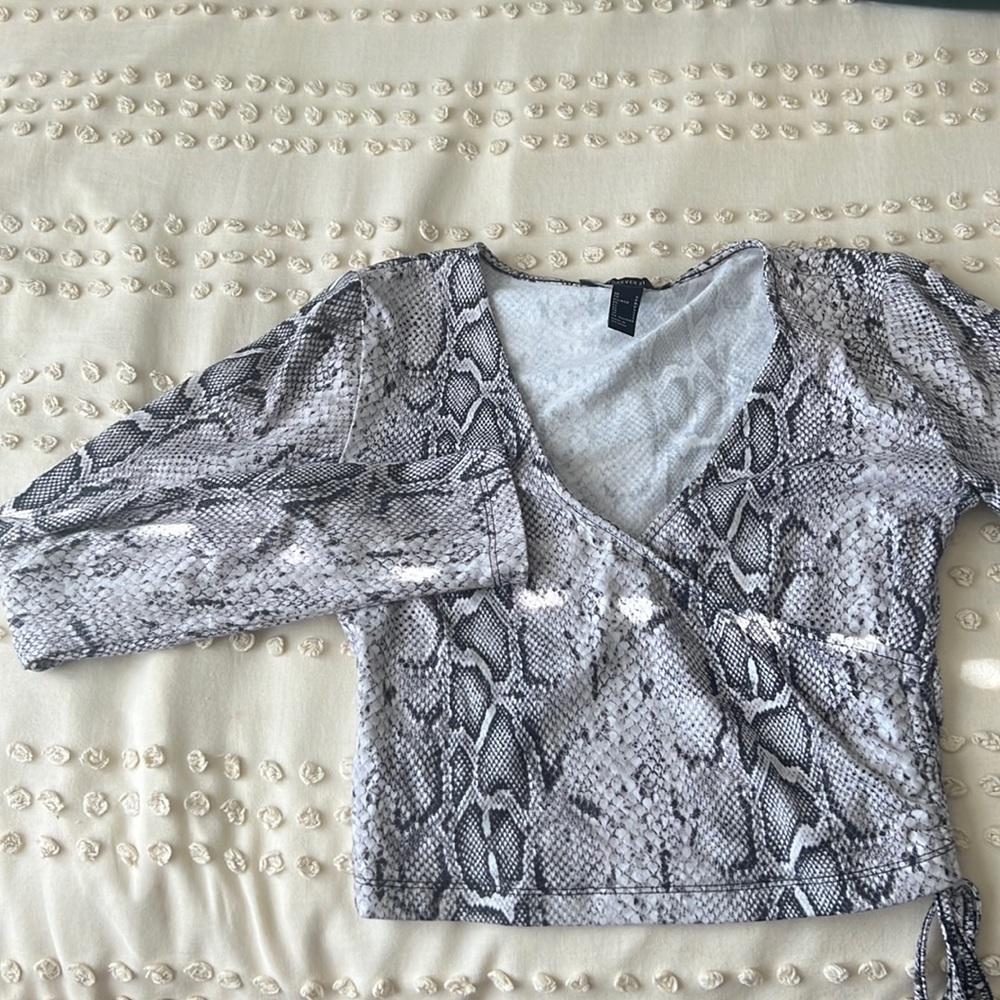 super soft, long sleeve, snake print shirt, is a little cropped